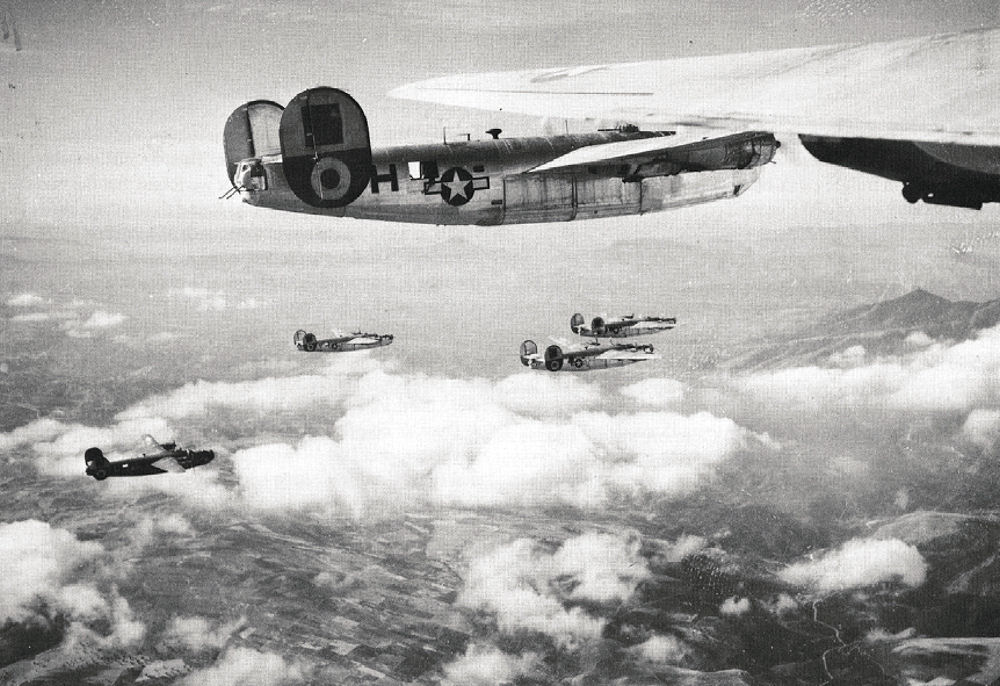 Pictured are American Consolidated B-24 Liberator bombers like the ones that bombed IG Farben on September 13, 1944.